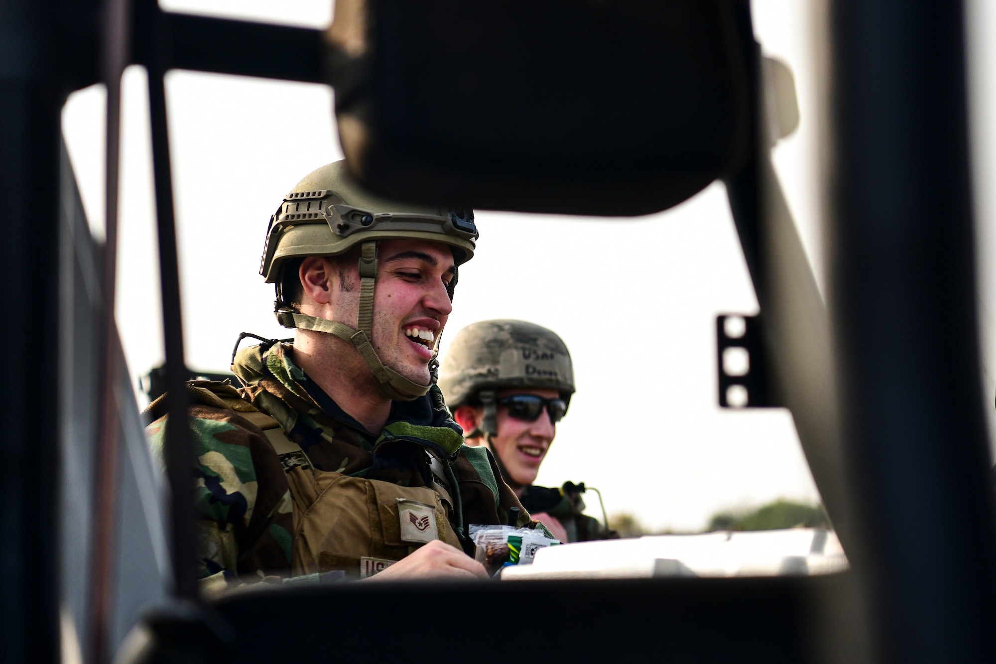 An Airman enjoys food during training.