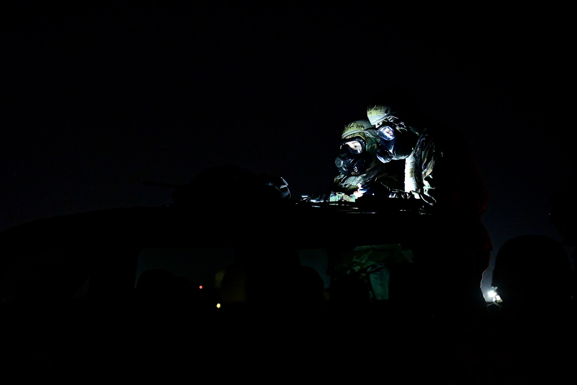 Airmen review aircraft flight plans.