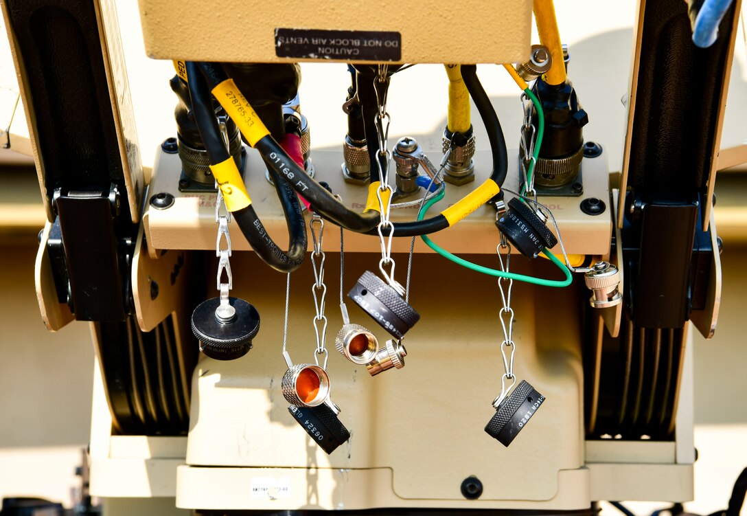 The 8th Communication Squadron setup a Hawkeye 3 satellite dish for the communications flyaway kit that provides secure data anywhere at any time at Kunsan Air Base, Republic of Korea, Nov 3. 2021. The communication squadron tested their ability to setup a remote network access that provides secure data anywhere, any time. (U.S. Air Force photo by Staff Sgt. Jesenia Landaverde)