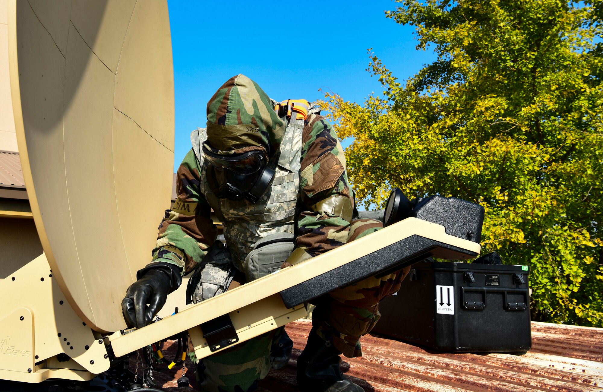 U.S. Space Force Specialist 3 Emmanuel Londono, 8th Communication Squadron radio frequency technician, adjusts the power amplifier to a Hawkeye 3 satellite dish for a communications flyaway kit at Kunsan Air Base, Republic of Korea, Nov 3. 2021. The communication squadron tested their ability to setup a remote network access that provides secure data anywhere, anytime. (U.S. Air Force photo by Staff Sgt. Jesenia Landaverde)