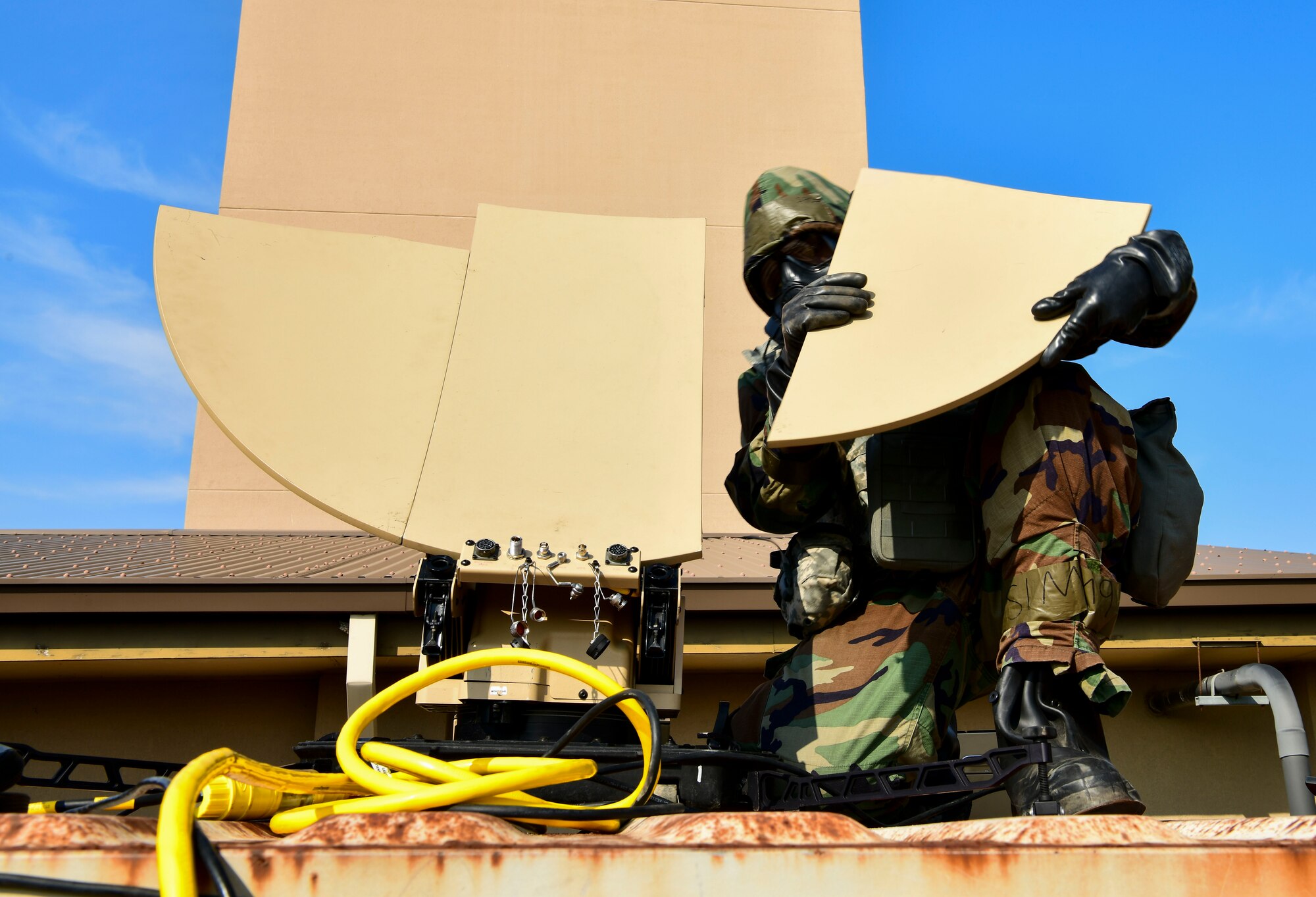 U.S. Space Force Specialist 3 Emmanuel Londono, 8th Communication Squadron radio frequency technician, assembles a Hawkeye 3 satellite dish for a communications flyaway kit at Kunsan Air Base, Republic of Korea, Nov 3. 2021. The communication squadron tested their ability to setup a remote network access that provides secure data anywhere, anytime. (U.S. Air Force photo by Staff Sgt. Jesenia Landaverde)