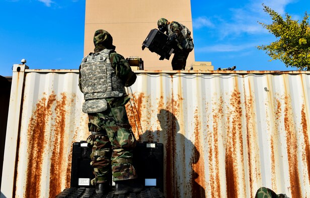 The 8th Communication Squadron setup a Hawkeye 3 satellite dish for the communications flyaway kit that provides secure data anywhere at any time at Kunsan Air Base, Republic of Korea, Nov 3. 2021. The communication squadron tested their ability to setup a remote network access that provides secure data anywhere, any time. (U.S. Air Force photo by Staff Sgt. Jesenia Landaverde)