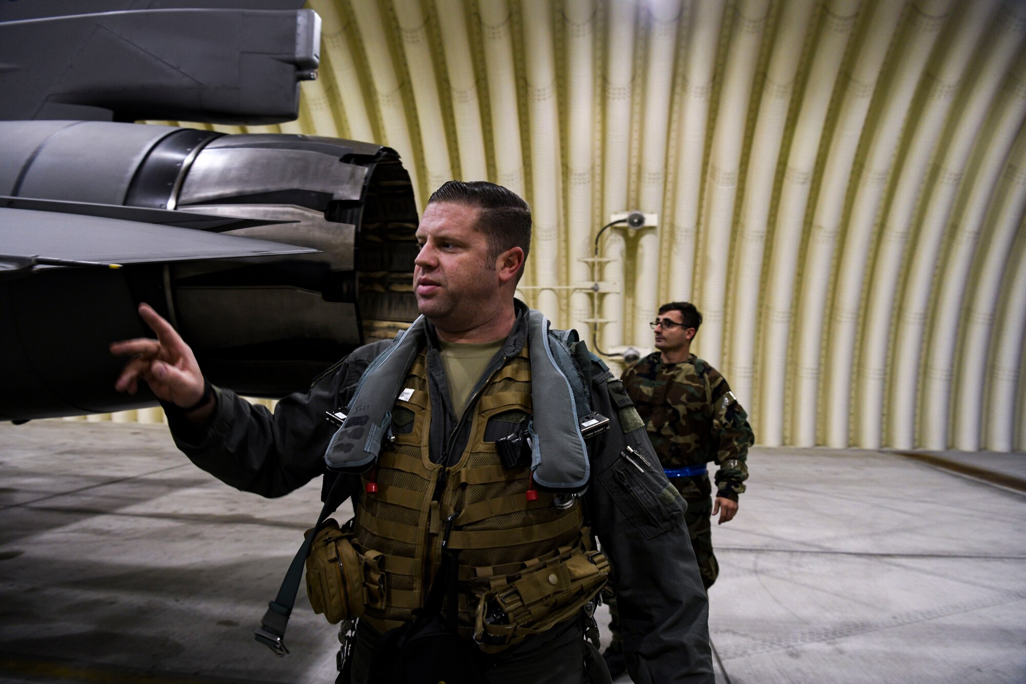 Major Willem “Kong” Van Loon, 80th Fighter Squadron F-16 Fighting Falcon pilot, inspects aircraft with Airman 1st Class Rodrigo Soifakis, 35th Aircraft Maintenance Unit assistant dedicated crew chief, at Kunsan Air Base, Republic Of Korea, Nov. 1, 2021. Kunsan’s fighting squadrons lead the combat air forces as the lethal fighter squadrons of motivated, expertly trained warriors focused on the defense of the Republic of Korea and regional stability in the Pacific. (U.S. Air Force photo by Staff Sgt. Jesenia Landaverde)