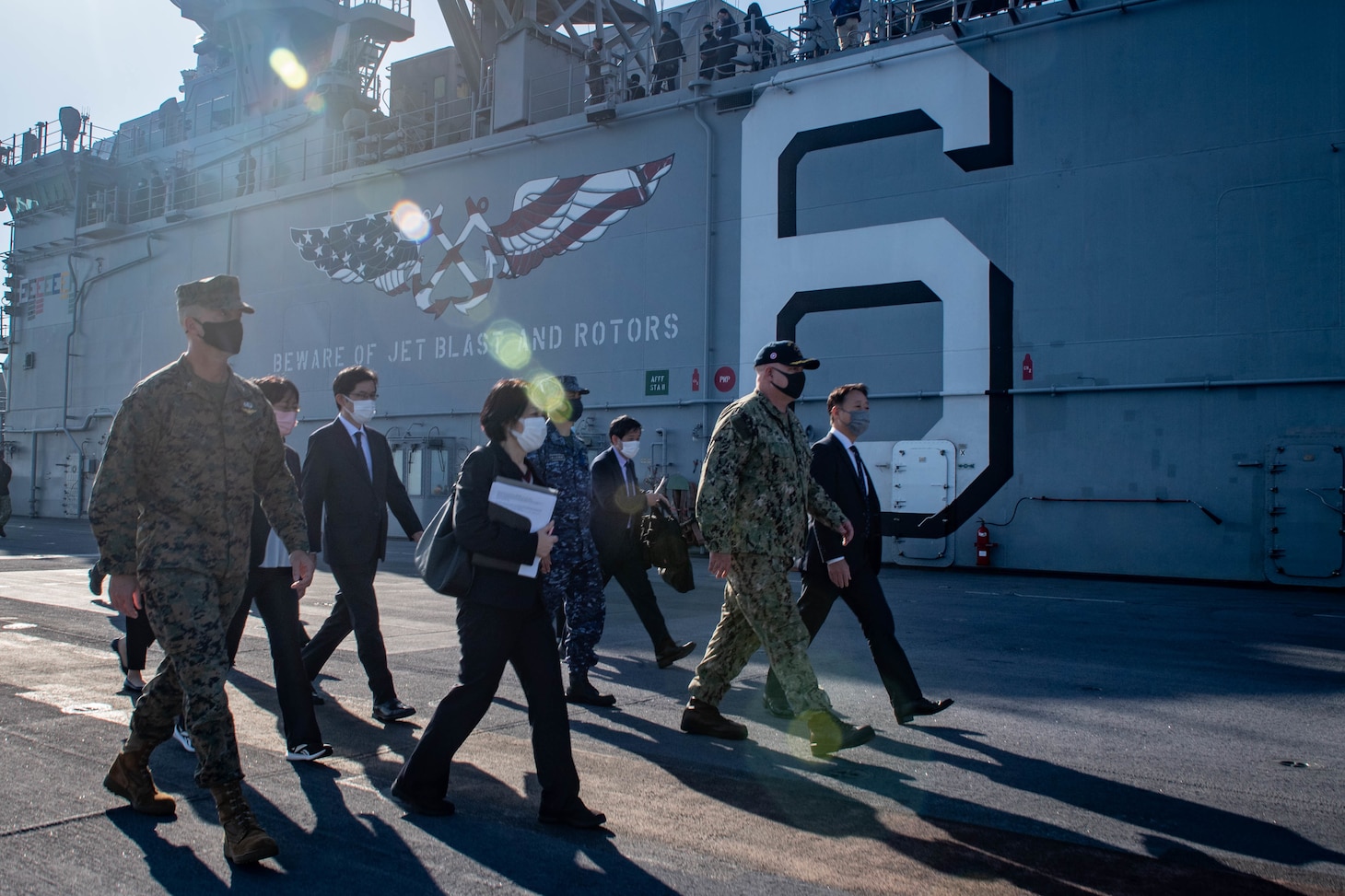 Capt. Ken Ward, commanding officer of the forward-deployed amphibious assault ship USS America (LHA 6), second from right, leads a tour for local and regional civic and military leadership on the ship’s flight deck during a port visit to Marine Corps Air Station Iwakuni. America, lead ship of the America Amphibious Ready Group, is operating in the U.S. 7th Fleet area of responsibility to enhance interoperability with allies and partners and serve as a ready response force to defend peace and stability in the Indo-Pacific region.