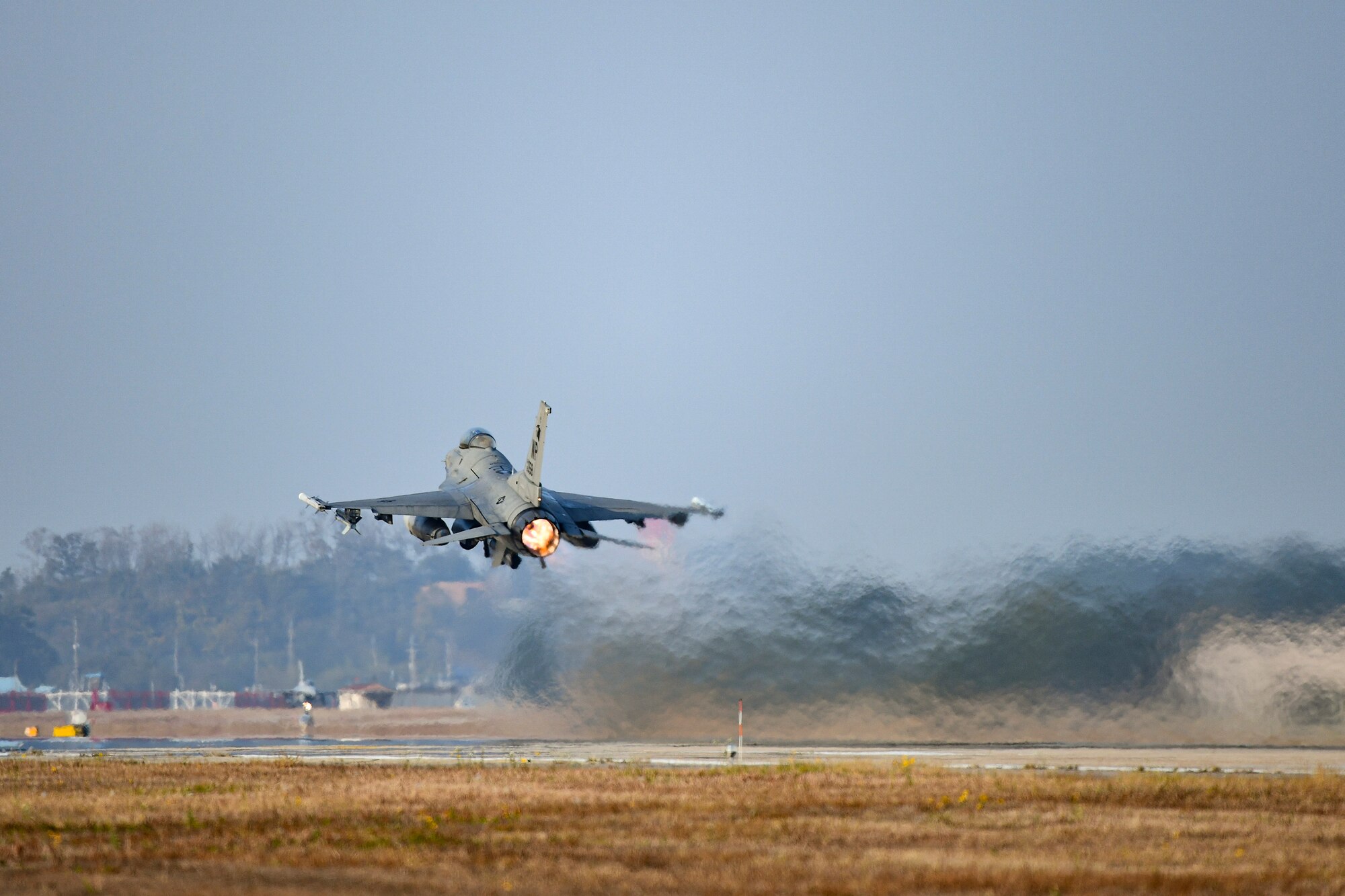 A fighter jet takes off.