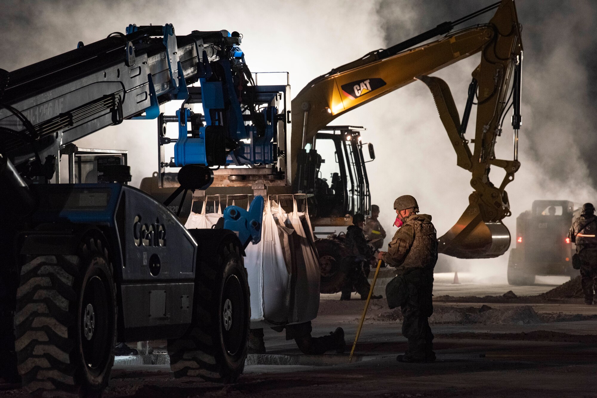 Airmen assigned to the 8th Civil Engineer Squadron prepare to repair a simulated crater during a Rapid Airfield Damage Repair routine training