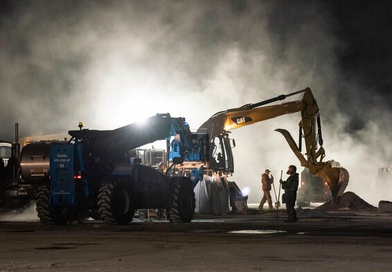 Airmen assigned to the 8th Civil Engineer Squadron prepare to repair a simulated crater during a Rapid Airfield Damage Repair routine training