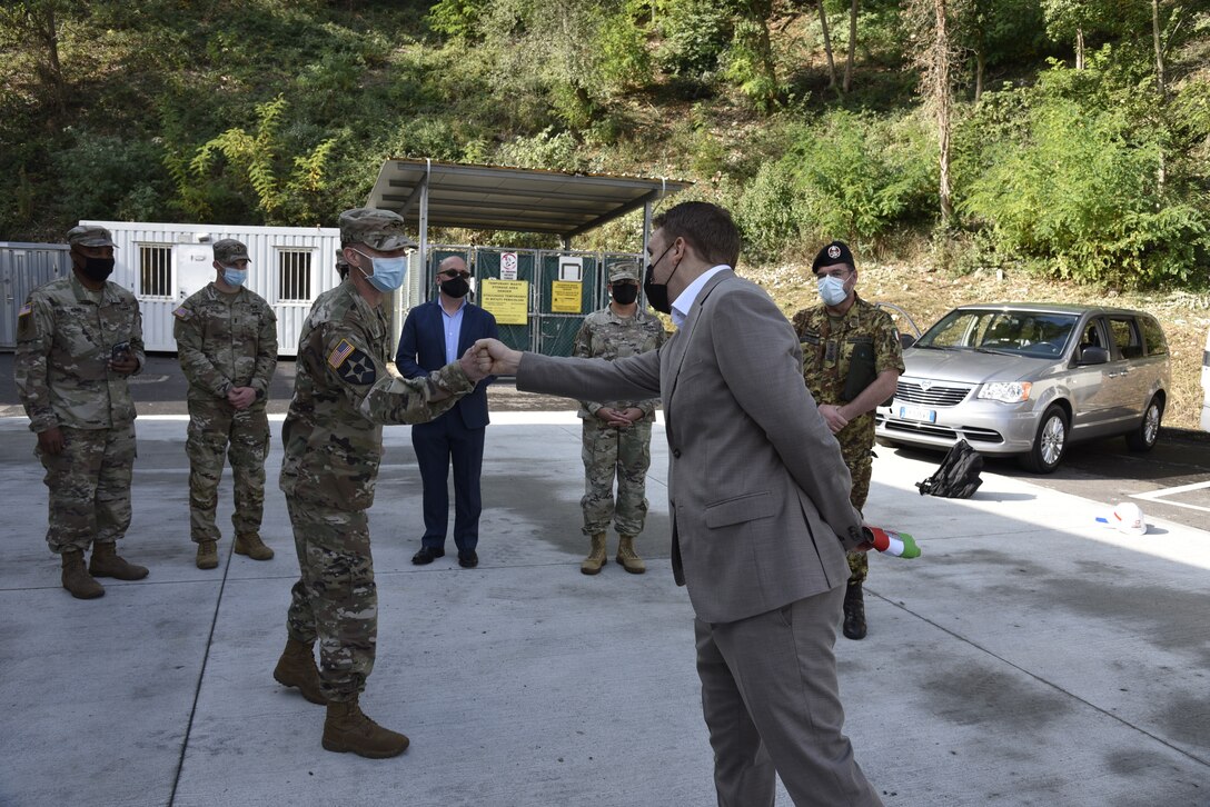 U.S. Army Corps of Engineers, Europe District Commander Col. Pat Dagon fist bumps with Longare Mayor Matteo Zennaro as officials gathered ahead of a tour of the U.S. Army facilities at Longare that highlighted ongoing and planned construction October 4, 2021. The U.S. Army Corps of Engineers, Europe District is managing a $30 million construction and renovation program primarily funded by U.S. Army Intelligence and Security Command, U.S. Africa Command and U.S. Army Southern European Task Force, Africa to provide the 207th MIB(T) improved facilities at the Longare and Caserma Ederle portions of U.S. Army Garrison Italy. (U.S. Army photo by Chris Gardner)
