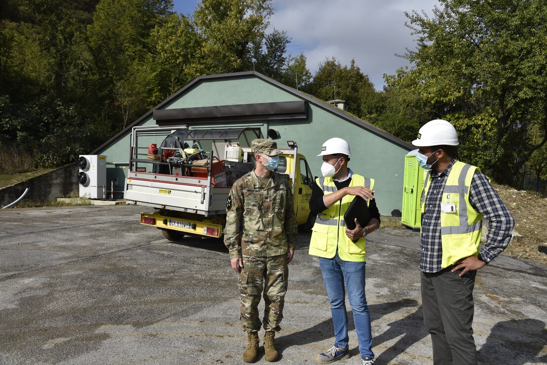 U.S. Army Corps of Engineers, Europe District Commander Col. Pat Dagon discusses ongoing parking lot improvement efforts with contractors on site on a plateau with office space at Longare, a mountainside military installation, during a visit to project sites on the installation October 4, 2021. The U.S. Army Corps of Engineers, Europe District is managing a $30 million construction and renovation program primarily funded by U.S. Army Intelligence and Security Command, U.S. Africa Command and U.S. Army Southern European Task Force, Africa to provide the 207th MIB(T) improved facilities at the Longare and Caserma Ederle portions of U.S. Army Garrison Italy. (U.S. Army photo by Chris Gardner)