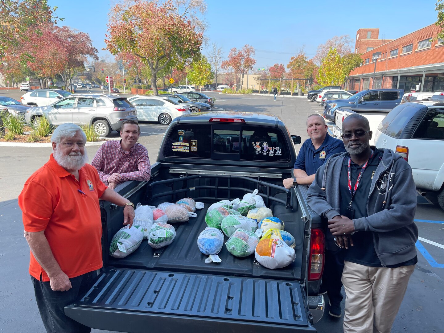 From the left: William King (processing supervisor), Spencer J. Albrecht (human resources assistant), Matthew P. McBride (test control officer) and Wallace A. Oliver (human resources assistant) are pictured in front of Sacramento MEPS during the turkey drive