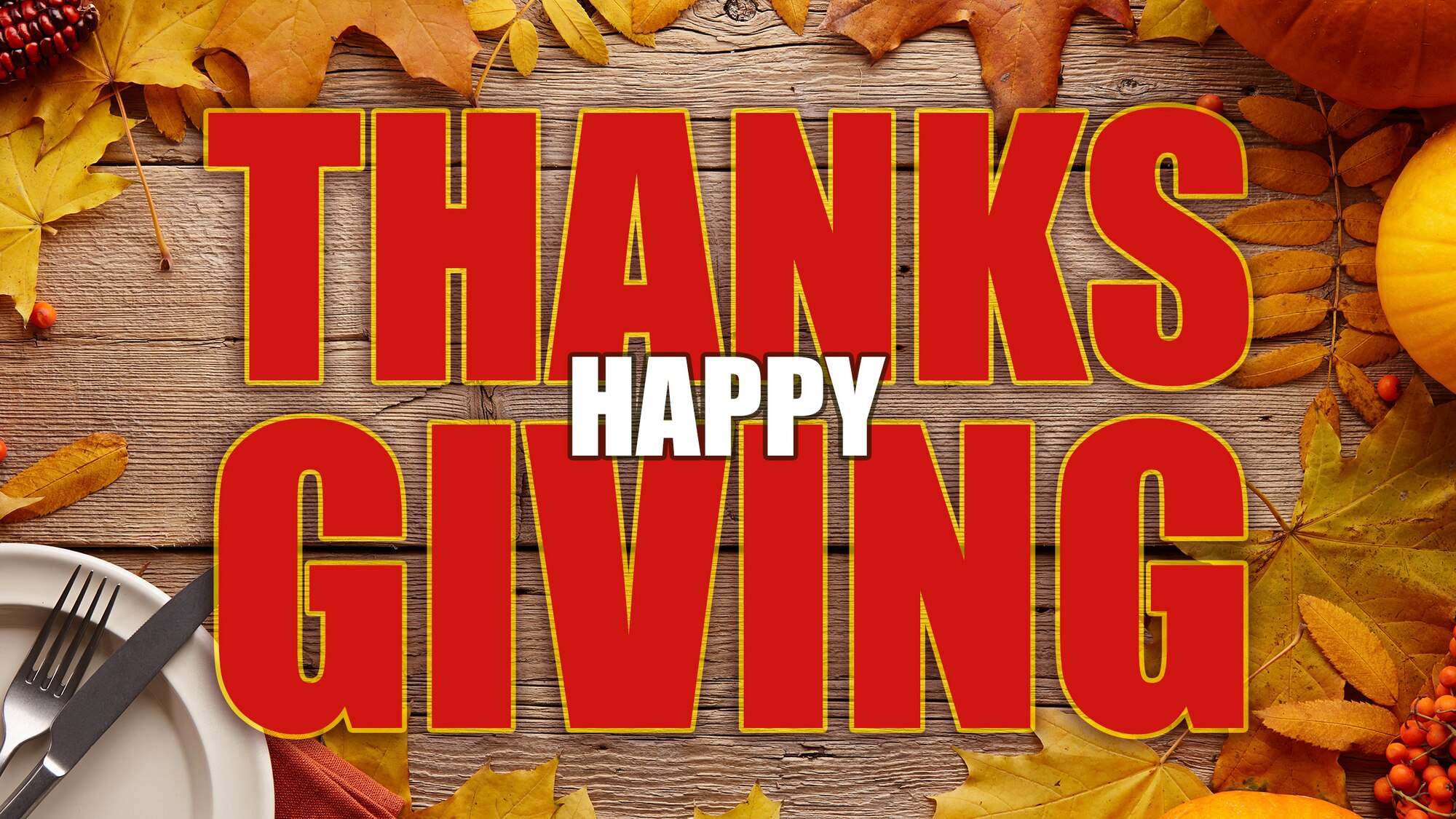 The words Happy Thanks-Giving appear over a wood table outlined by fall leaves, pumpkin, and plate.