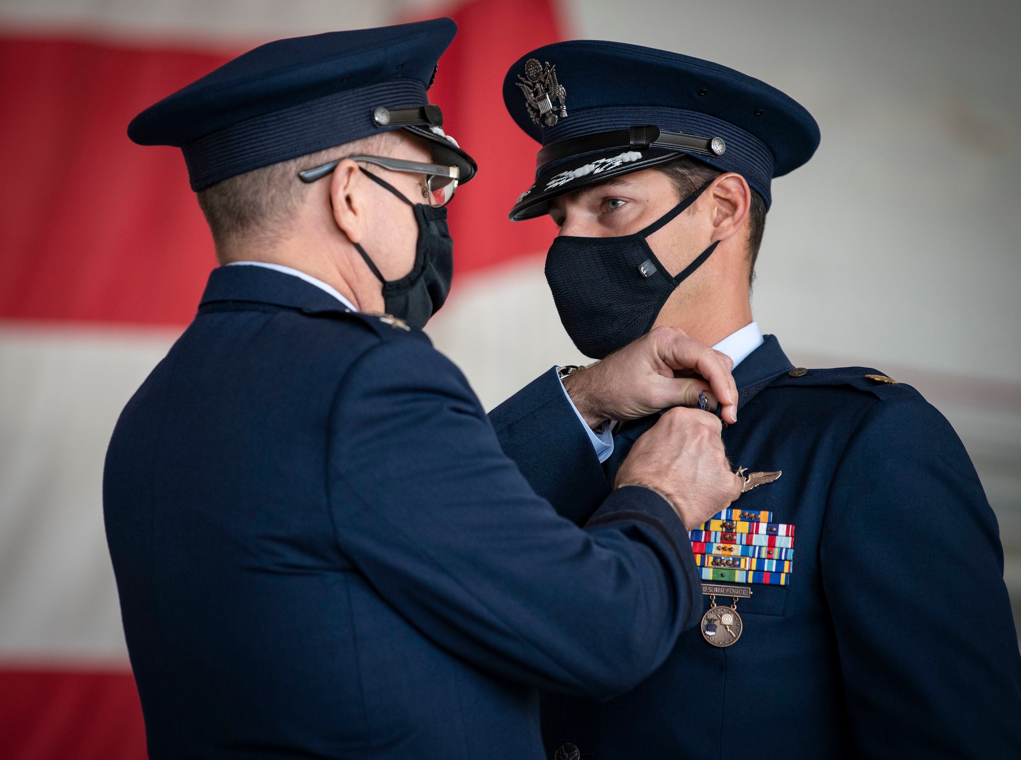 U.S. Air Force Maj. Jacob G. Broullire, 15th Expeditionary Special Operations Squadron MC-130H Combat Talon II aircraft commander, receives a Distinguished Flying Cross during a DFC presentation ceremony at Hurlburt Field, Florida, Nov. 8, 2021.