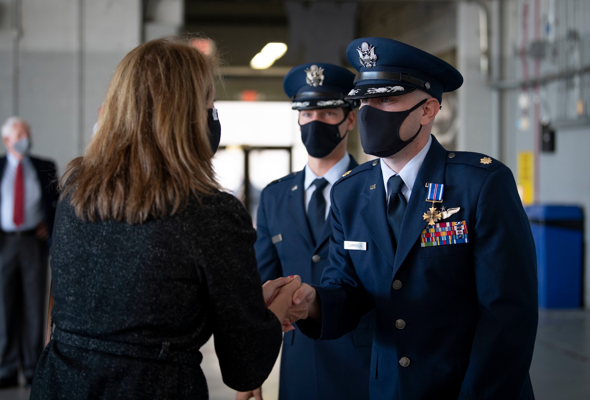 U.S. Air Force Maj. Christopher B. Summerlin, 15th Expeditionary Special Operations Squadron MC-130H Combat Talon II aircraft commander, is congratulated after receiving the Distinguished Flying Cross at a ceremony at Hurlburt Field, Florida, Nov. 8, 2021.