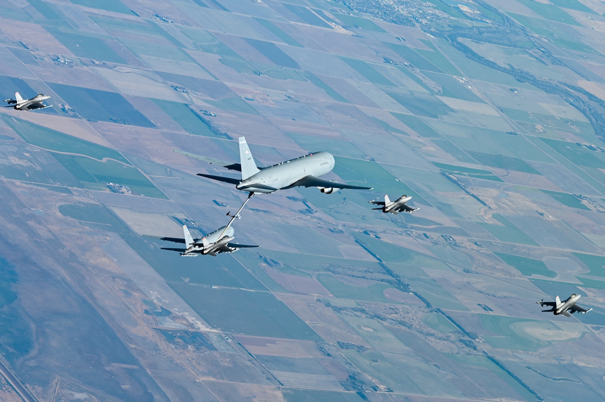 A KC-46A Pegasus from Pease Air National Guard Base N.H., with a mixed crew from four Major Commands refuel an F-16 Fighting Falcon assigned to 138th Fighter Wing, Tulsa Air National Guard Base, Oklahoma, Nov. 18, 2021. The Weapons Systems Council event was the result of months of coordination and planning by the 344th Air Refueling Squadron, McConnell’s first flying squadron to operate the KC-46. (U.S. Air Force photo by Airman 1st Class Zachary Willis)