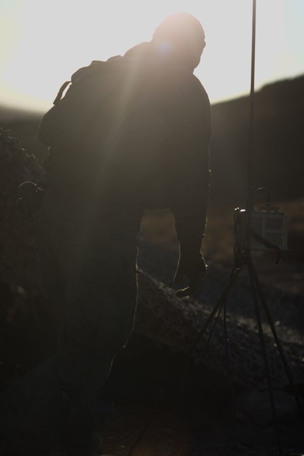 U.S. Marine Corps Lance Cpl. Kolton J. Lewis, a rifleman with Golf Company (G Co.), 2d Battalion, 5th Marine Regiment, 1st Marine Division, sets up a Puma Unmanned Aerial System during Marine Air-Ground Task Force Warfighting Exercise 1-22 (MWX 1-22) at Marine Corps Air Ground Combat Center Twentynine Palms, California, Oct. 26, 2021. Marines with G Co. set up a defensive position and executed reconnaissance flights to locate enemy movement during MWX 1-22. (U.S. Marine Corps photo by Sgt. Jamin M. Powell)
