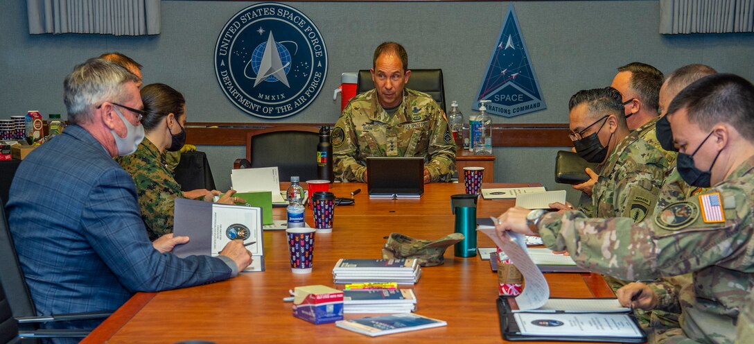 U.S. Space Force general speaks with U.S. Space Command service members.