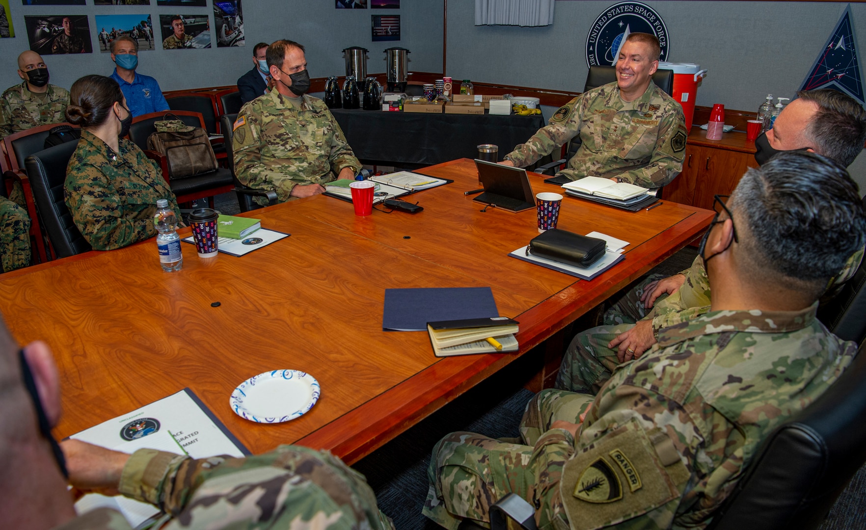 U.S. Air Force general speaks with U.S. Space Command service members.