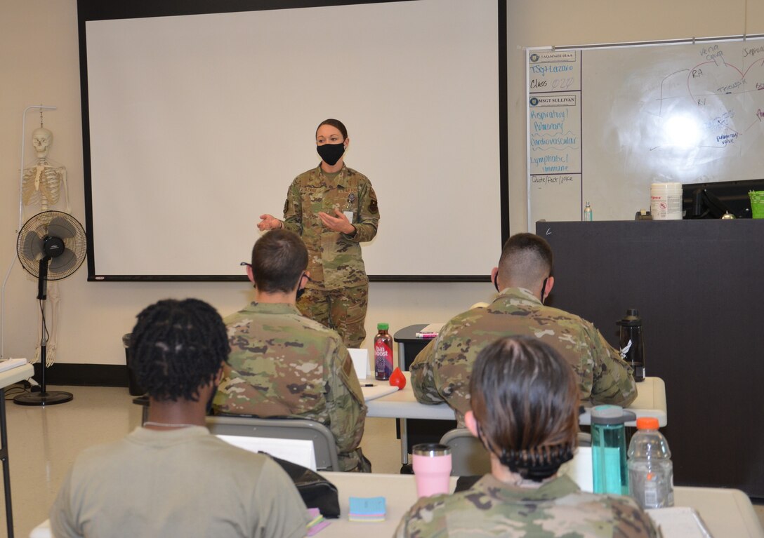 Tech. Sgt. Jessica Lazaro, an instructor in the Air Force Aerospace Medical Service Apprentice program at the Medical Education and Training Campus, Fort Sam Houston, Texas, talks to her class about her experience helping victims of a multiple car accident recently. Lazaro took the opportunity to make her experience a teachable moment for her students.