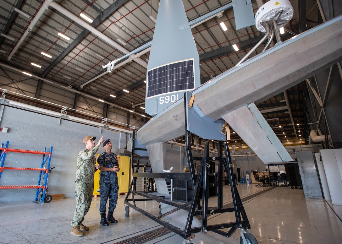 Vice Adm. Brad Cooper, commander of U.S. Naval Forces Central Command, U.S. 5th Fleet and Combined Maritime Forces, left, and Col. Hisham Khaleel Aljarrah, commander of the Royal Jordanian Naval Force, examine Task Force 59’s new Saildrone Explorer unmanned surface vessel at Naval Support Activity Bahrain, Nov. 18. The visit signaled U.S. 5th Fleet’s commitment to partnering with Jordan after establishing the new unmanned task force in September 2021. (U.S. Navy photo by Mass Communication Specialist 2nd Class Mark Thomas Mahmod).