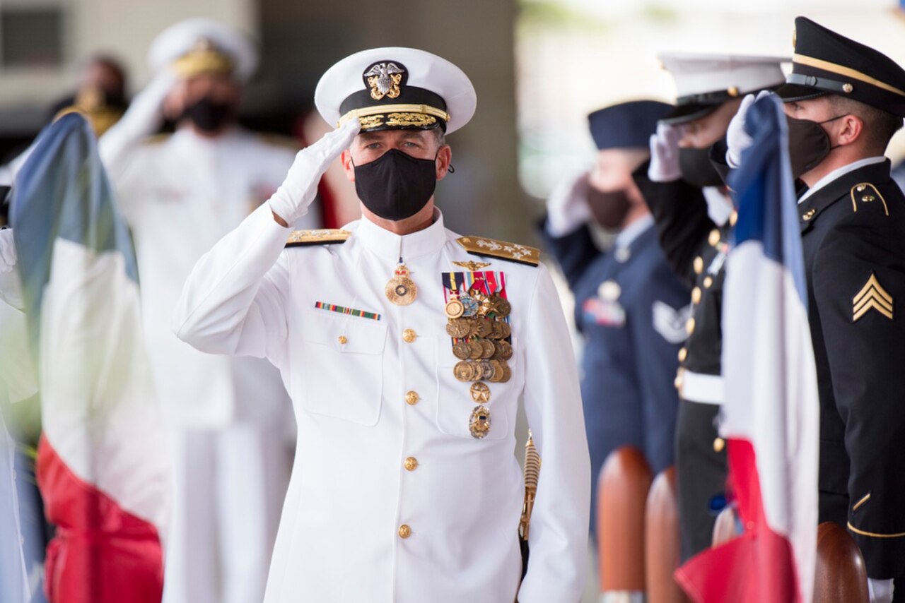 Navy admiral joins change of command ceremony.