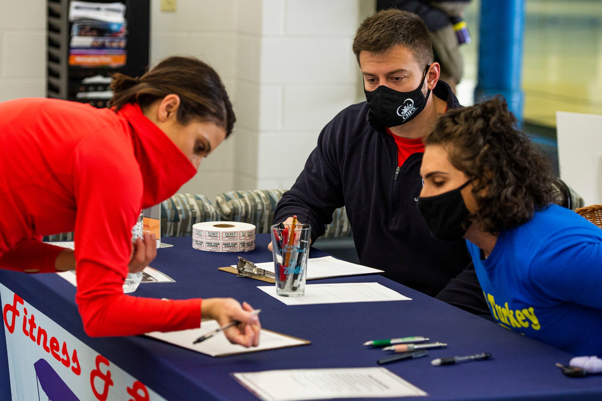 Participants check-in for the 88th Force Support Squadron’s Turkey Trot 5k Fun Run inside the Wright Field Fitness Center Nov. 18, 2021, at Wright-Patterson Air Force Base, Ohio. Due to COVID, runners were released in waves of 10 this year to help with social distancing. (U.S. Air Force photo by Wesley Farnsworth)