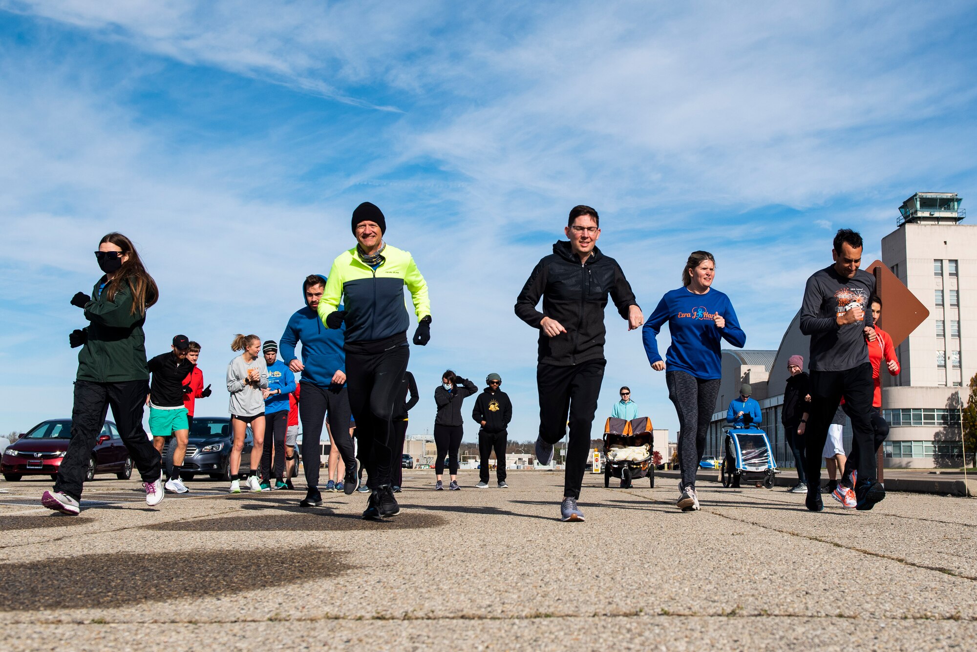 Participants take off from the starting line of the 88th Force Support Squadron’s Turkey Trot 5k Fun Run at Wright-Patterson Air Force Base, Ohio, Nov. 18, 2021. Due to COVID runners were released in waves of 10 this year to help with social distancing. (U.S. Air Force photo by Wesley Farnsworth)