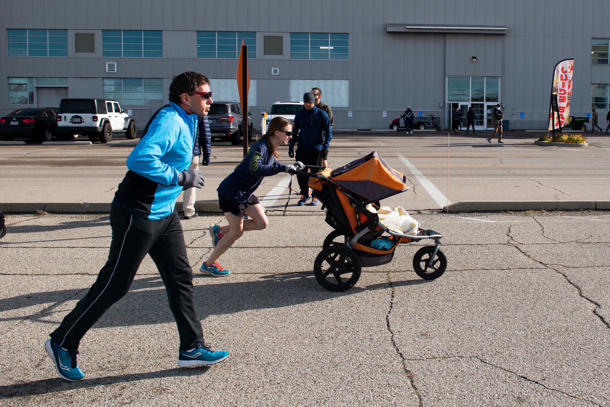 Participants take off from the starting line of the 88th Force Support Squadron’s Turkey Trot 5k Fun Run at Wright-Patterson Air Force Base, Ohio, Nov. 18, 2021. Due to COVID runners were released in waves of 10 this year to help with social distancing. (U.S. Air Force photo by Wesley Farnsworth)