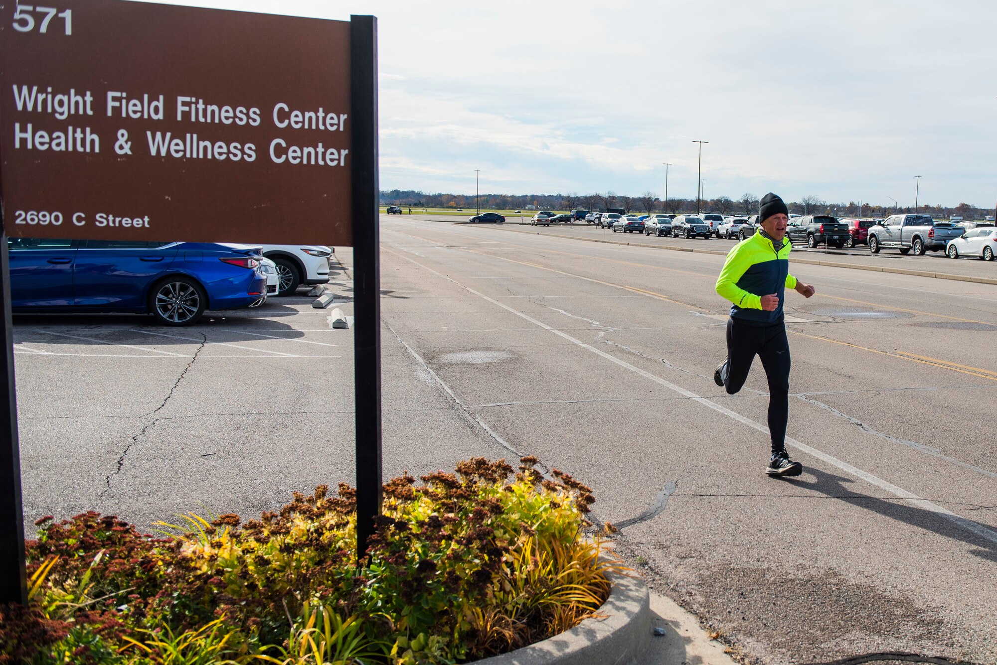 A runner crosses the finish line of the 88th Force Support Squadron’s Turkey Trot 5k Fun Run, Nov. 18, 2021, at Wright-Patterson Air Force Base, Ohio. Due to COVID, runners were released in waves of 10 this year to help with social distancing. (U.S. Air Force photo by Wesley Farnsworth)