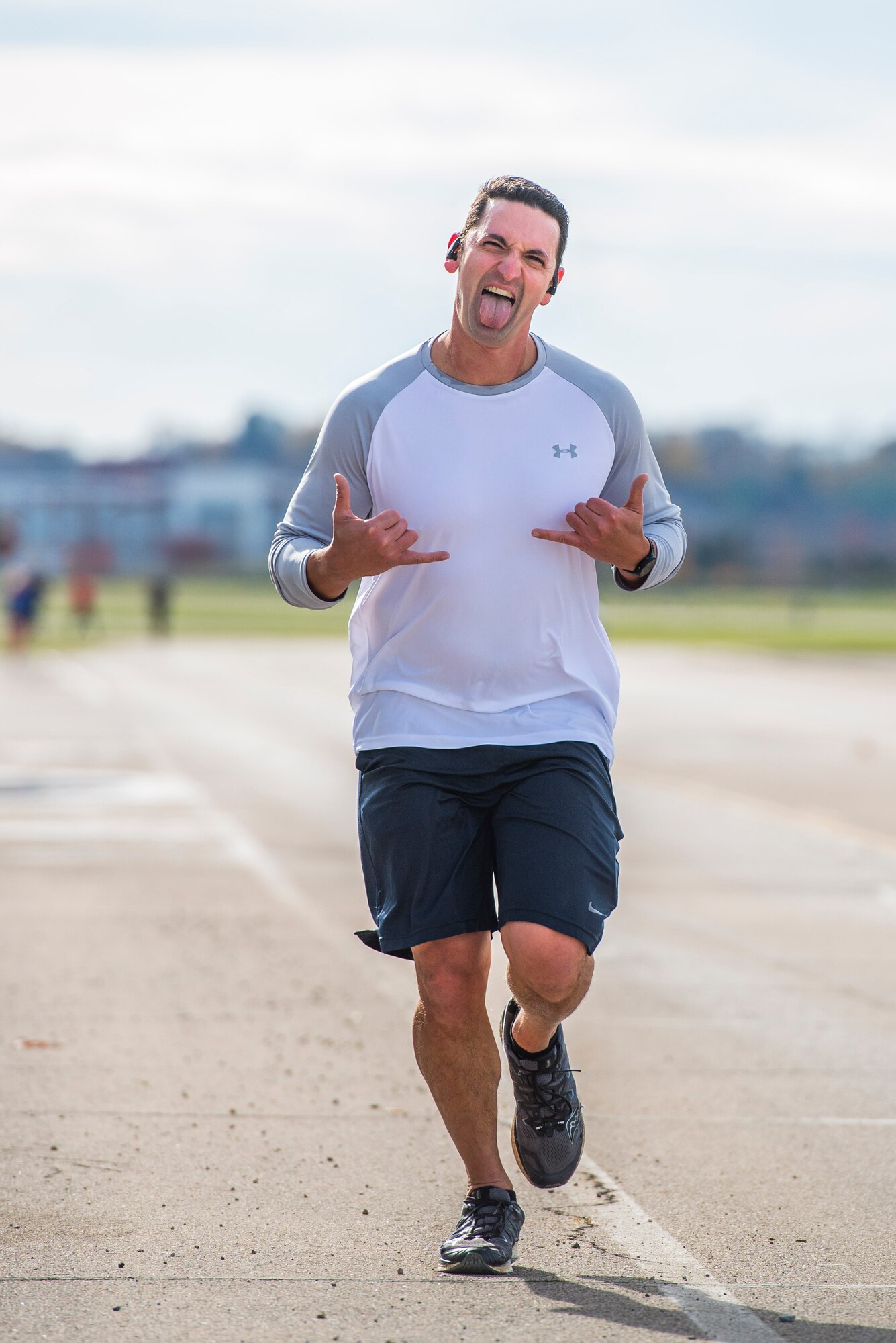 A runner pushes through the final stretch of the 88th Force Support Squadron’s Turkey Trot 5k Fun Run at Wright-Patterson Air Force Base, Nov. 18, 2021. Due to COVID runners were released in waves of 10 this year to help with social distancing. (U.S. Air Force photo by Wesley Farnsworth)
