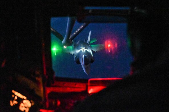 U.S. Air Force Tech. Sgt. Andrew Valence, 54th Air Refueling Squadron boom operator instructor, refuels an F-35 Lightning II from a KC-135 Stratotanker, Nov. 16, 2021. Aircrew students refueled approximately 11 F-35s and 13 F-16 Fighting Falcons during this training night. (U.S. Air Force photo by Airman 1st Class Kayla Christenson)