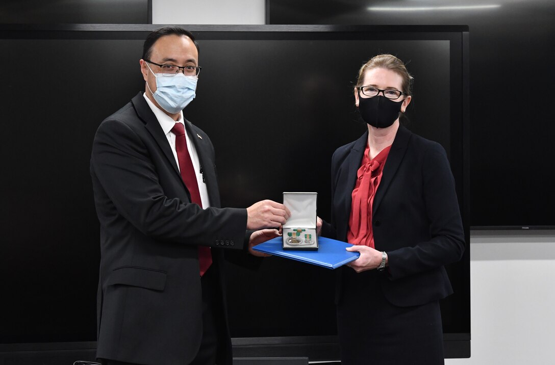 IMAGE: Naval Surface Warfare Center Dahlgren Division Dam Neck Activity System Safety Practitioner Dana Sevier is presented with her Civilian Service Achievement Medal (CSAM) by her division head James Yee. The CSAM is awarded to Department of the Navy and Marine Corps civilians for exceptional sustained performance or a specific outstanding achievement.