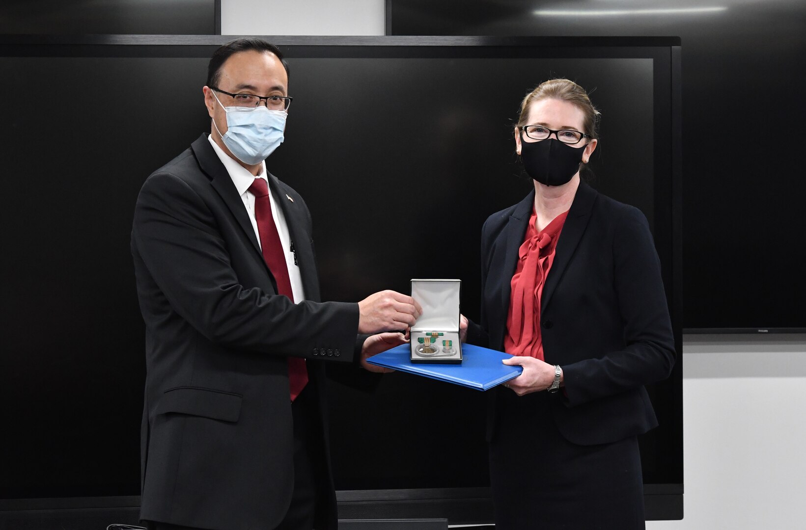 IMAGE: Naval Surface Warfare Center Dahlgren Division Dam Neck Activity System Safety Practitioner Dana Sevier is presented with her Civilian Service Achievement Medal (CSAM) by her division head James Yee. The CSAM is awarded to Department of the Navy and Marine Corps civilians for exceptional sustained performance or a specific outstanding achievement.