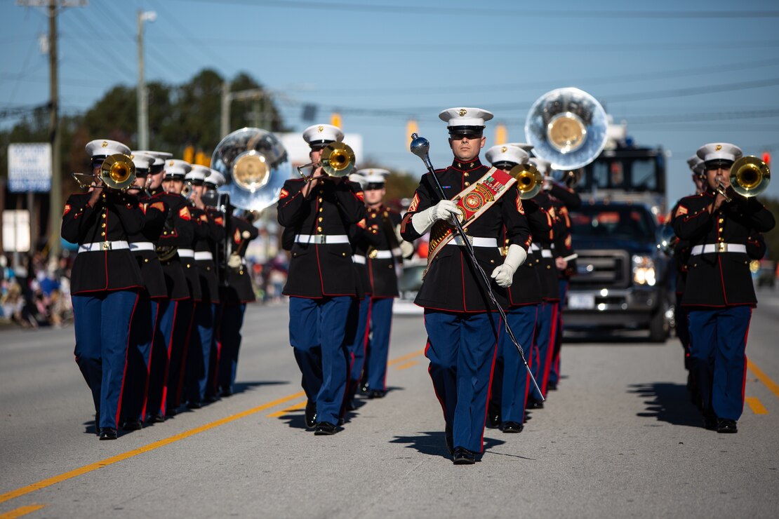 U.S. Marines with the 2nd Marine Division Band march during the 2021 Christmas Holiday Parade in Jacksonville, North Carolina, Nov. 20, 2021.