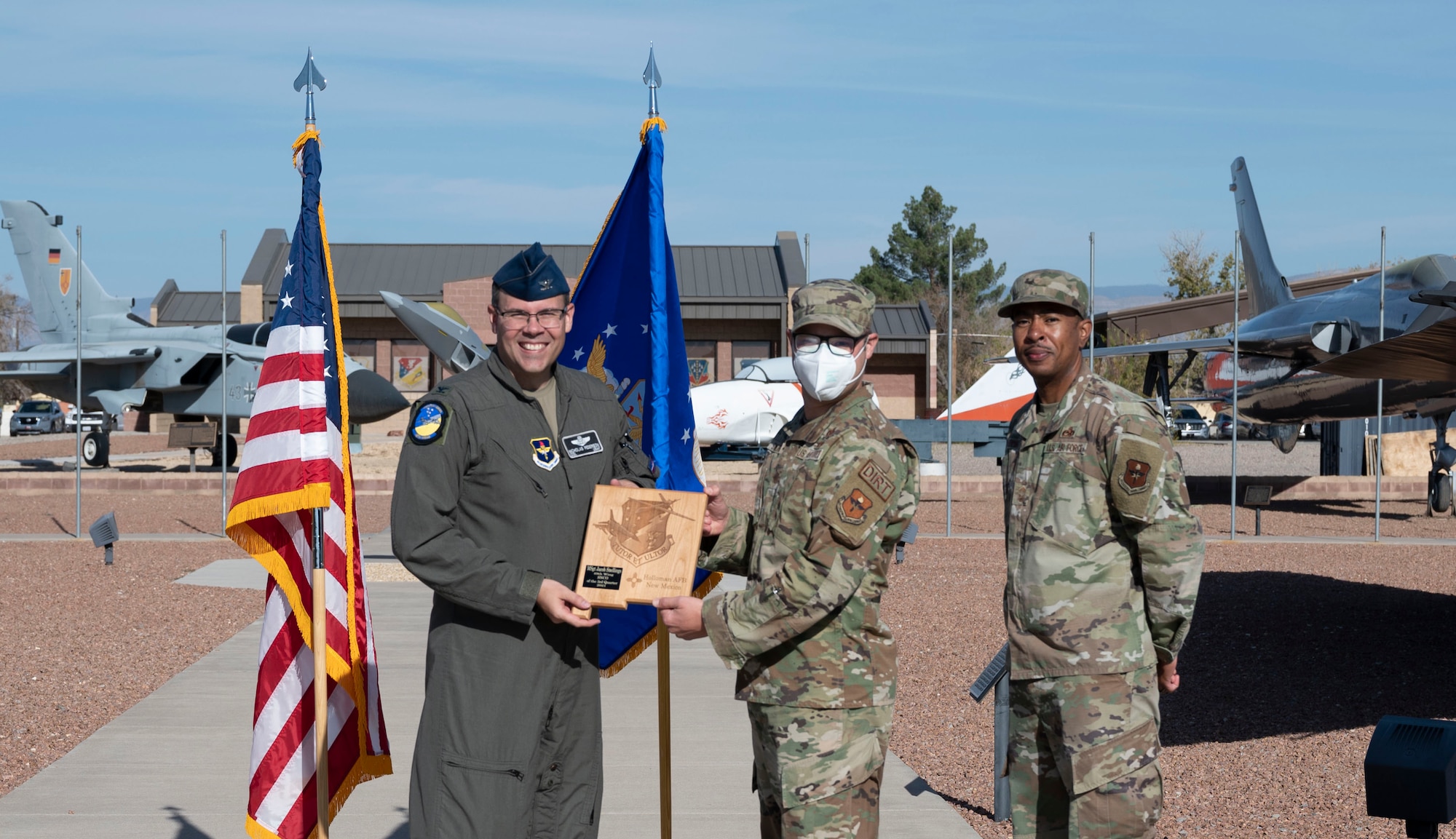 Master Sgt. Jacob Snellings, quarterly award winner, accepts the senior noncommisioned officer of the quarter award during the 49th Wing’s 3rd ceremony, Nov. 19, 2021, on Holloman Air Force Base, New Mexico. Quarterly award winners were selected based on their technical expertise, demonstration of leadership and job performance. (U.S. Air Force photo by Airman 1st Class Antonio Salfran)