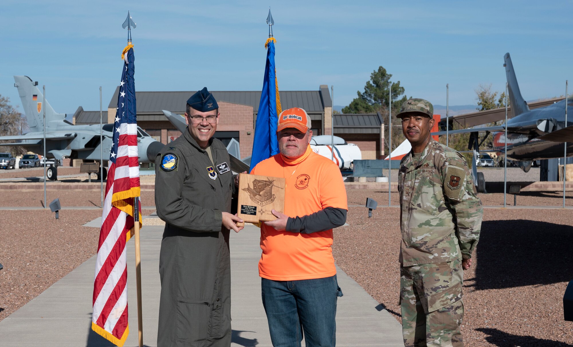 Brian Mcintosh, quarterly award winner, accepts the Civilian Category II Supervisory of the quarter award during the 49th Wing’s 3rd quarter award ceremony, Nov. 19, 2021, on Holloman Air Force Base, New Mexico. Quarterly award winners were selected based on their technical expertise, demonstration of leadership and job performance. (U.S. Air Force photo by Airman 1st Class Antonio Salfran)