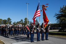 U.S. Marines with the 2nd Marine Division color guard and band prepare to march during the 2021 Christmas Holiday Parade in Jacksonville, North Carolina, Nov. 20, 2021.