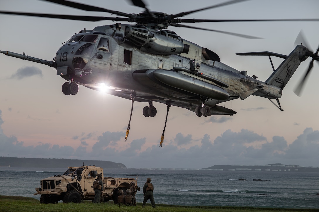 A U.S. Marine Corps CH-53E Super Stallion with Marine Medium Tiltrotor Squadron (VMM) 265 (reinforced) prepares to lift a Joint Light Tactical Vehicle during Helicopter Support Team (HST) training on Landing Zone Swan, Okinawa, Japan, Sept. 28, 2021. HST’s allow the Marines to swiftly transport heavy equipment by air to a vast range of locations. The 31st MEU, the Marine Corps’ only continuously forward-deployed MEU, provides a flexible and lethal force ready to perform a wide range of military operations as the premier crisis response force in the Indo-Pacific region. (U.S. Marine Corps photo by Pfc. Joseph E. DeMarcus)