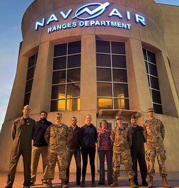 The U.S. Operational Test Team includes engineers, analysts, and pilots. UOTT team members, who conducted F-35 dedicated operational testing at the Naval Air Station Point Mugu Sea Test Range, stand in front of the Nav Air Ranges Building.
