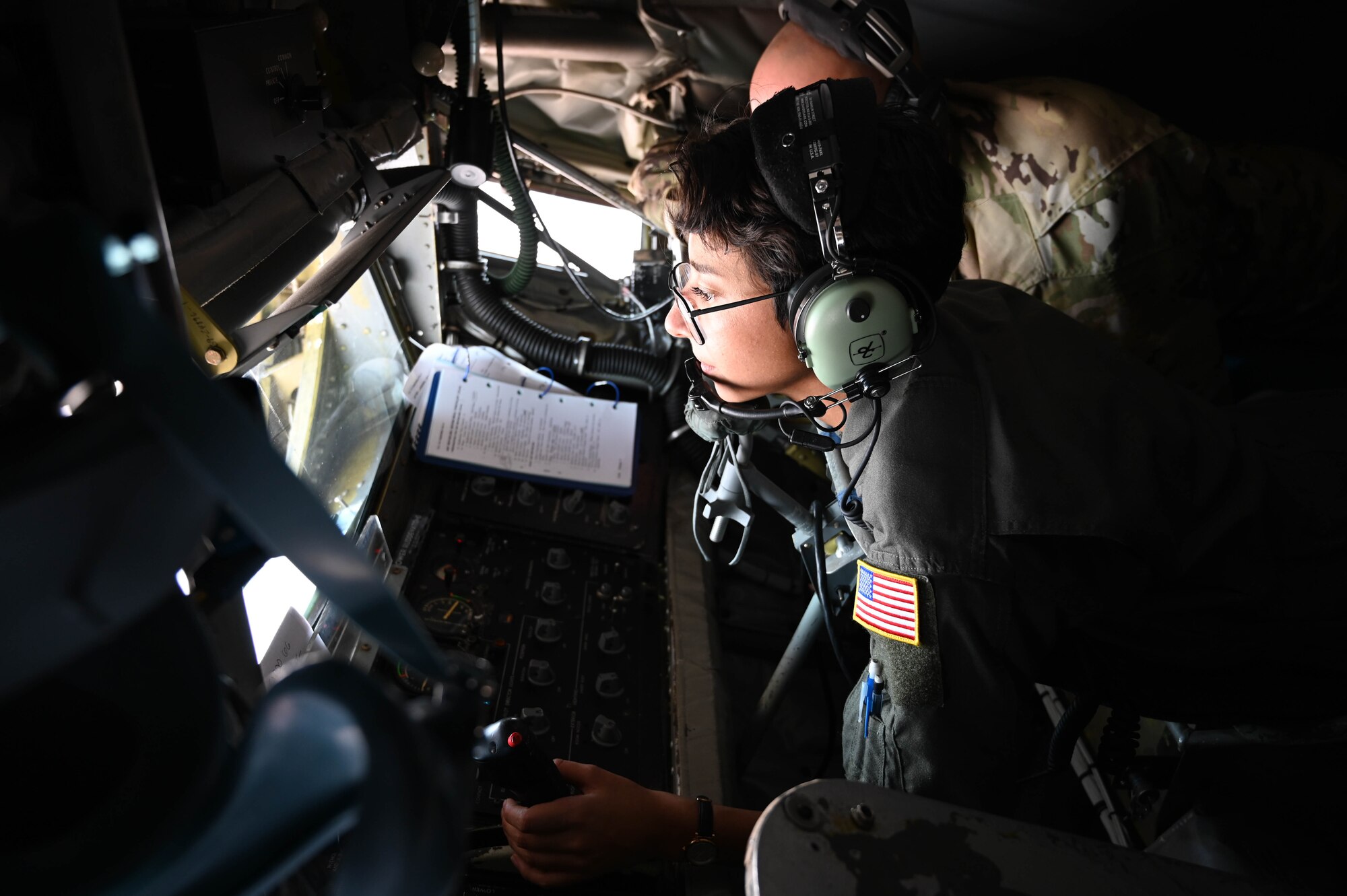 U.S. Air Force Airman 1st Class Carrie Martinez, 97th Training Squadron student, refuels a C-17 Globemaster III from a KC-135 Stratotanker, Nov. 15, 2021. This was Martinez’s first in-flight refueling as a boom operator, as well as her first time watching and completing a fighter jet refueling. (U.S. Air Force photo by Airman 1st Class Kayla Christenson)