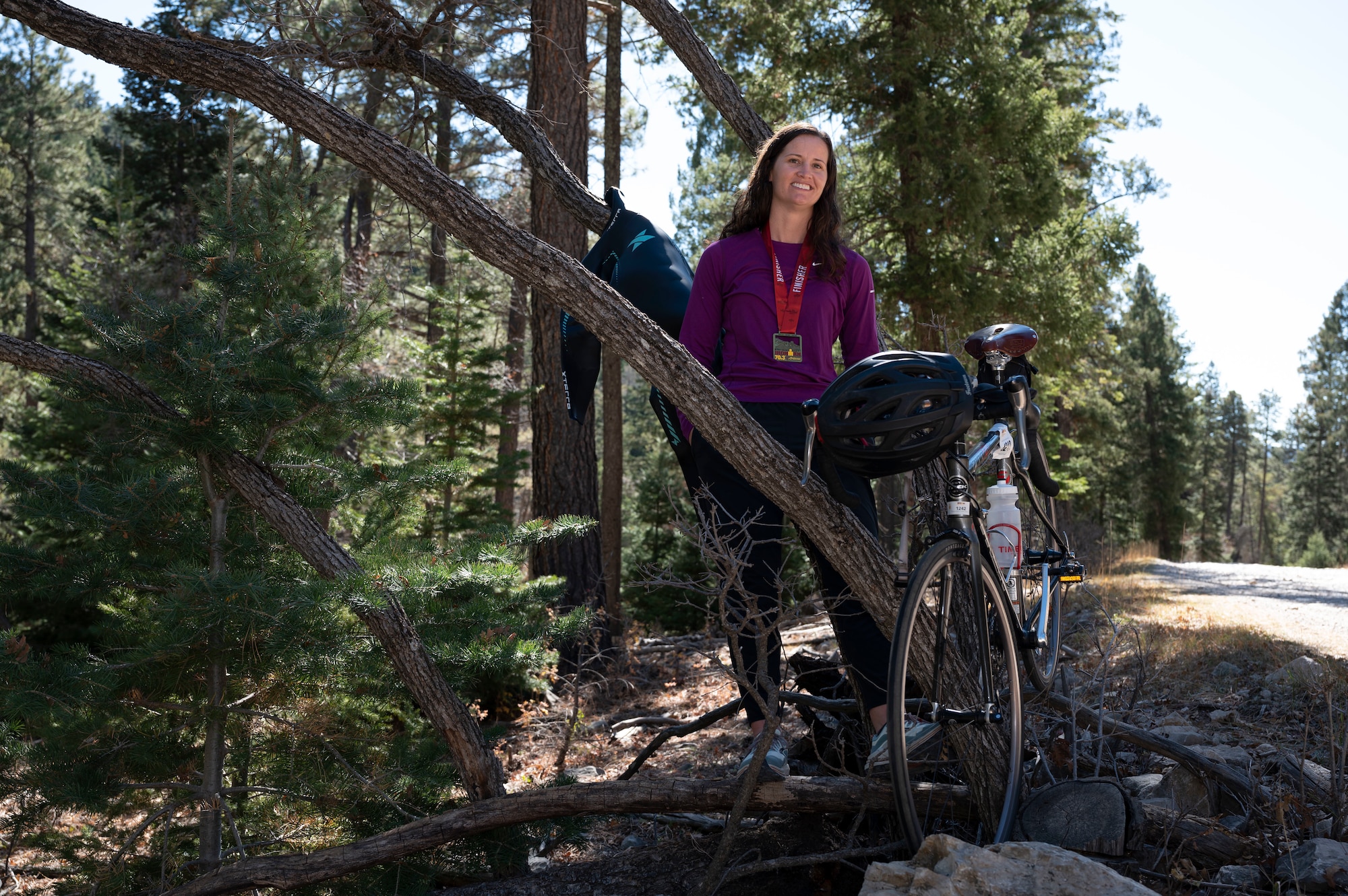 1st Lt. Ashley Corkins, 49th Wing junior executive officer, displays her triathlon equipment in Cloudcroft, New Mexico, Nov. 13, 2021. Corkins recently completed an Ironman 70.3 and trained for six months to ensure she could complete the race. (U.S. Air Force photo by Airman 1st Class Antonio Salfran)