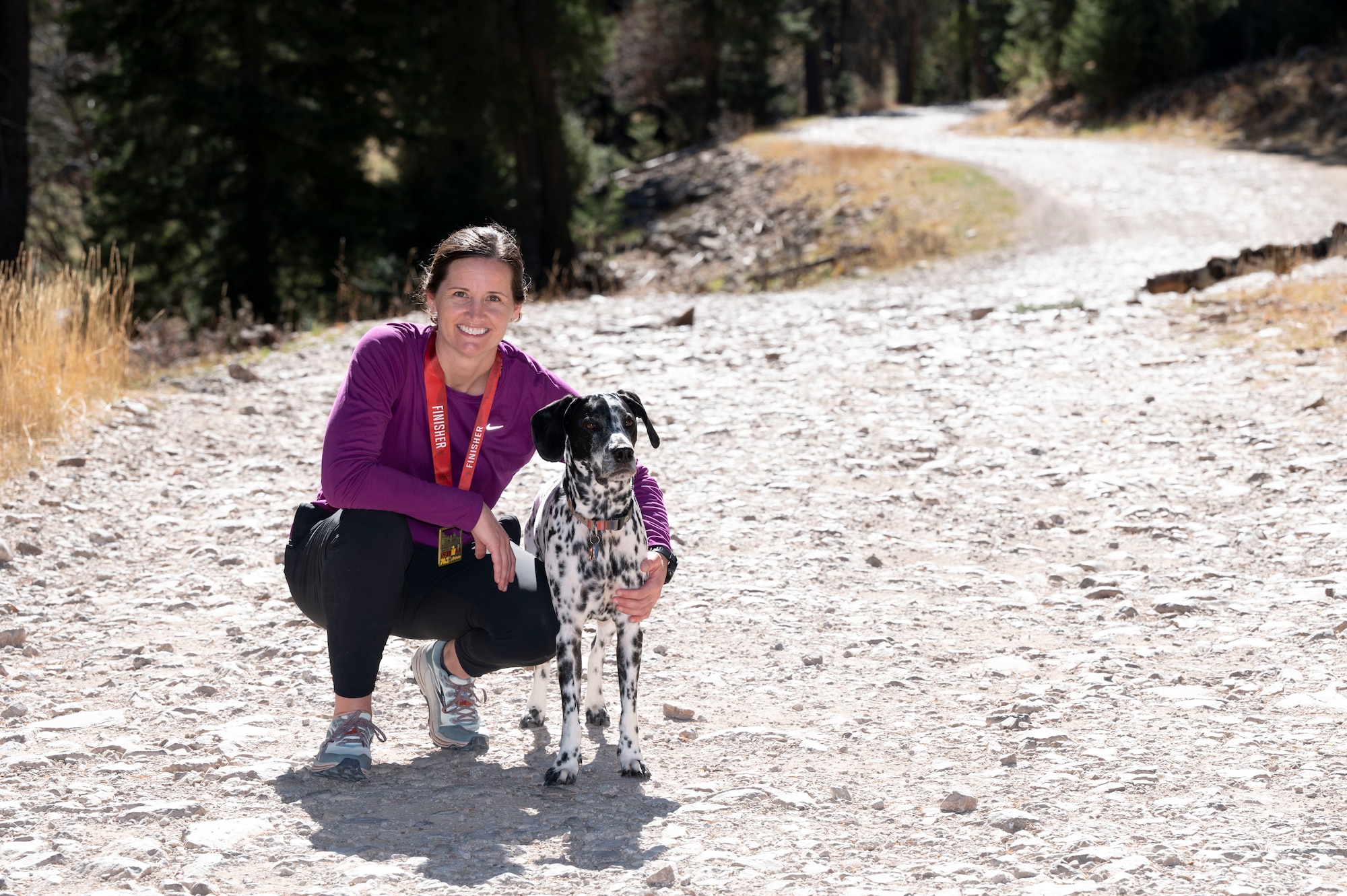 1st Lt. Ashley Corkins, 49th Wing junior executive officer, poses with her pet dog, Rugger, in Cloudcroft, New Mexico, Nov. 13, 2021. Rugger stood by Corkins’ side for the last six years and has served as a training partner as well as a best friend. (U.S. Air Force photo by Airman 1st Class Antonio Salfran)