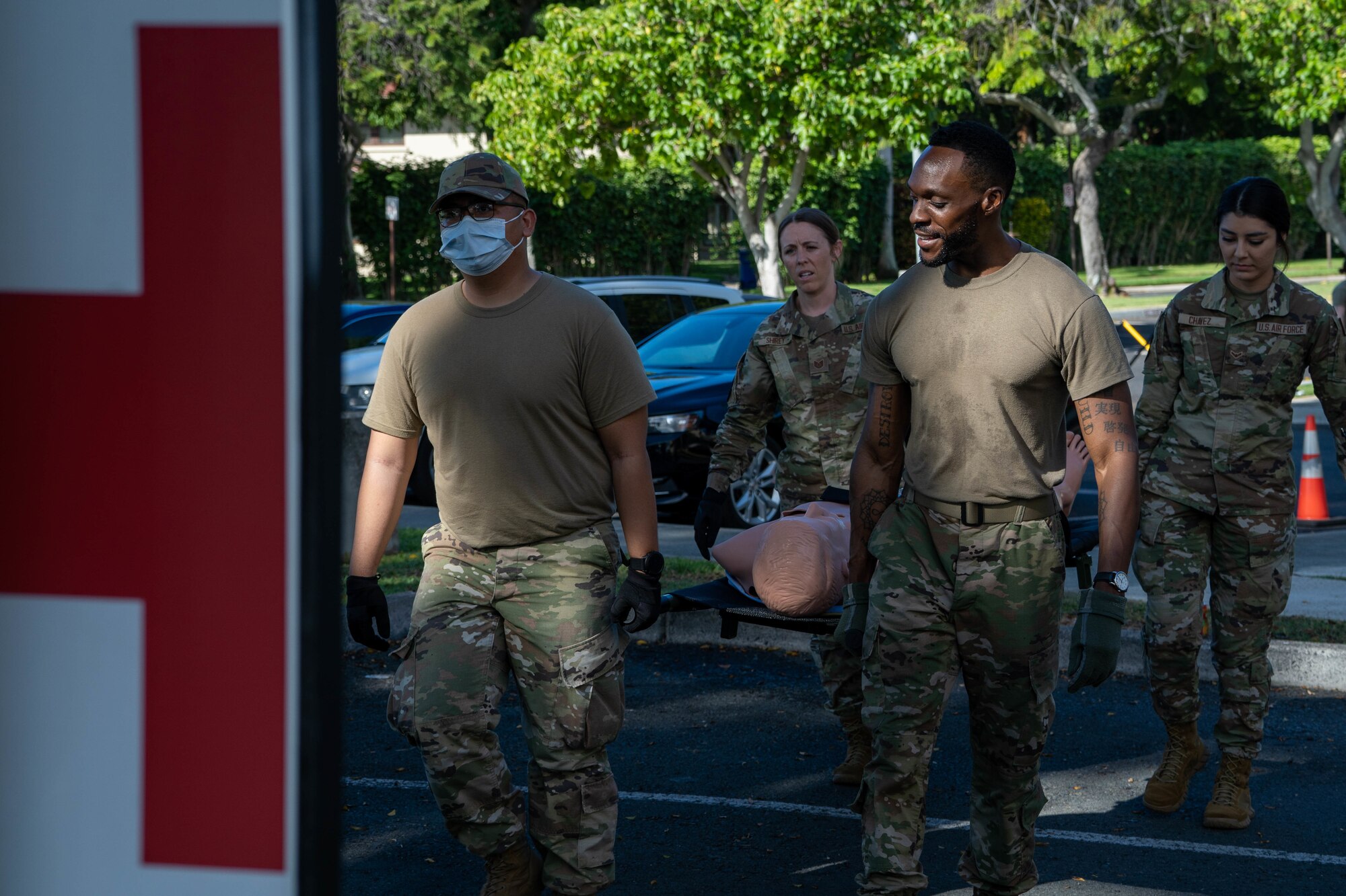 Airmen from the 15th Medical Group tend to simulated victims during a mass-casualty exercise at Joint Base Pearl Harbor-Hickam, Hawaii, Nov. 18, 2021. A mass-casualty exercise is a realistic training opportunity for medics to utilize their medical training in a controlled environment to prepare to save lives and strengthen their crisis-response abilities. (U.S. Air Force photo by Airman 1st Class Makensie Cooper)