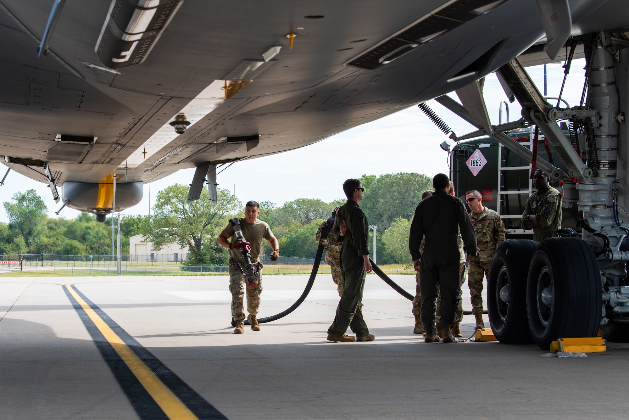 McConnell Air Force Base Airmen prepare to conduct a dual defuel Oct. 12, 2021. The rapid defuel capability will enable a KC-46 to support a fighter unit’s Integrated Combat Turn in austere locations. (U.S. Air Force photo by Airman 1st Class Zachary Willis)