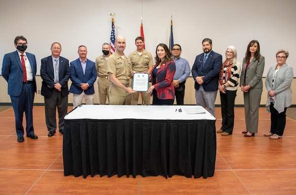 Naval Air Station Corpus Christi Commanding Officer Capt. Christopher Jason and Nueces County Judge Barbara Canales are joined by County and base leaders during a proclamation signing ceremony, Nov. 22.