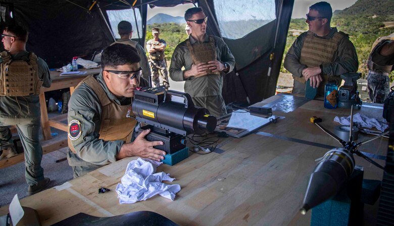 U.S. Marine Corps Sgt. Jose Gonzalez, an explosive ordnance disposal technician with Headquarters and Support Battalion, Marine Corps Installations Pacific, utilizes a Novo X-ray system to examine a projectile from an M136 Light Anti-Tank weapon during a range exercise on Camp Schwab, Okinawa, Japan, Oct. 26, 2021. Picatinny Arsenal and the Expeditionary Systems Engineering Division came to the bomb exploitation range to give a period of instruction to U.S military combat engineers and EOD technicians regarding insight on exploitation theory, with different logistical perspectives. (U.S. Marine Corps photo by Lance Cpl. Jonathan Beauchamp)