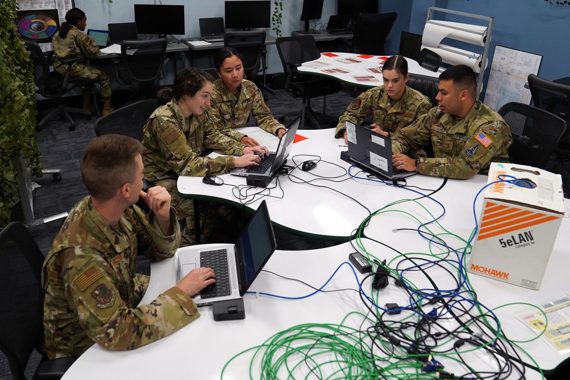 333rd Training Squadron cyber warfare officers complete cyber tasks in the cyber escape room inside Stennis Hall at Keesler Air Force Base, Mississippi, November 10, 2021. The escape room was implemented into the squadron to test the capabilities of cyber warfare students and sharpen their skillset. (U.S. Air Force photo by Senior Airman Seth Haddix)