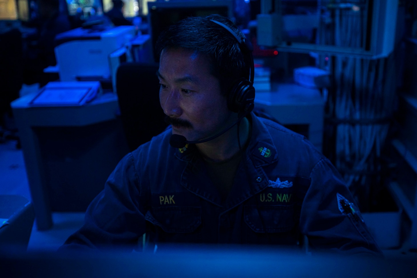 211122-N-QF023-1025 TAIWAN STRAIT (Nov. 22, 2021) Chief Electronics Technician Siggy Pak, from Milpitas, Calif., stands watch as the combat systems coordinator aboard Arleigh Burke-class guided-missile destroyer USS Milius (DDG 69) as the ship conducts a routine transit through the Taiwan Strait Nov. 22, 2021. Milius, assigned to Commander, Task Force (CTF) 71/Destroyer Squadron (DESRON) 15, is forward-deployed to the U.S. 7th Fleet area of operations in support of a free and open Indo-Pacific. (U.S. Navy photo by Mass Communication Specialist Seaman Apprentice RuKiyah Mack).