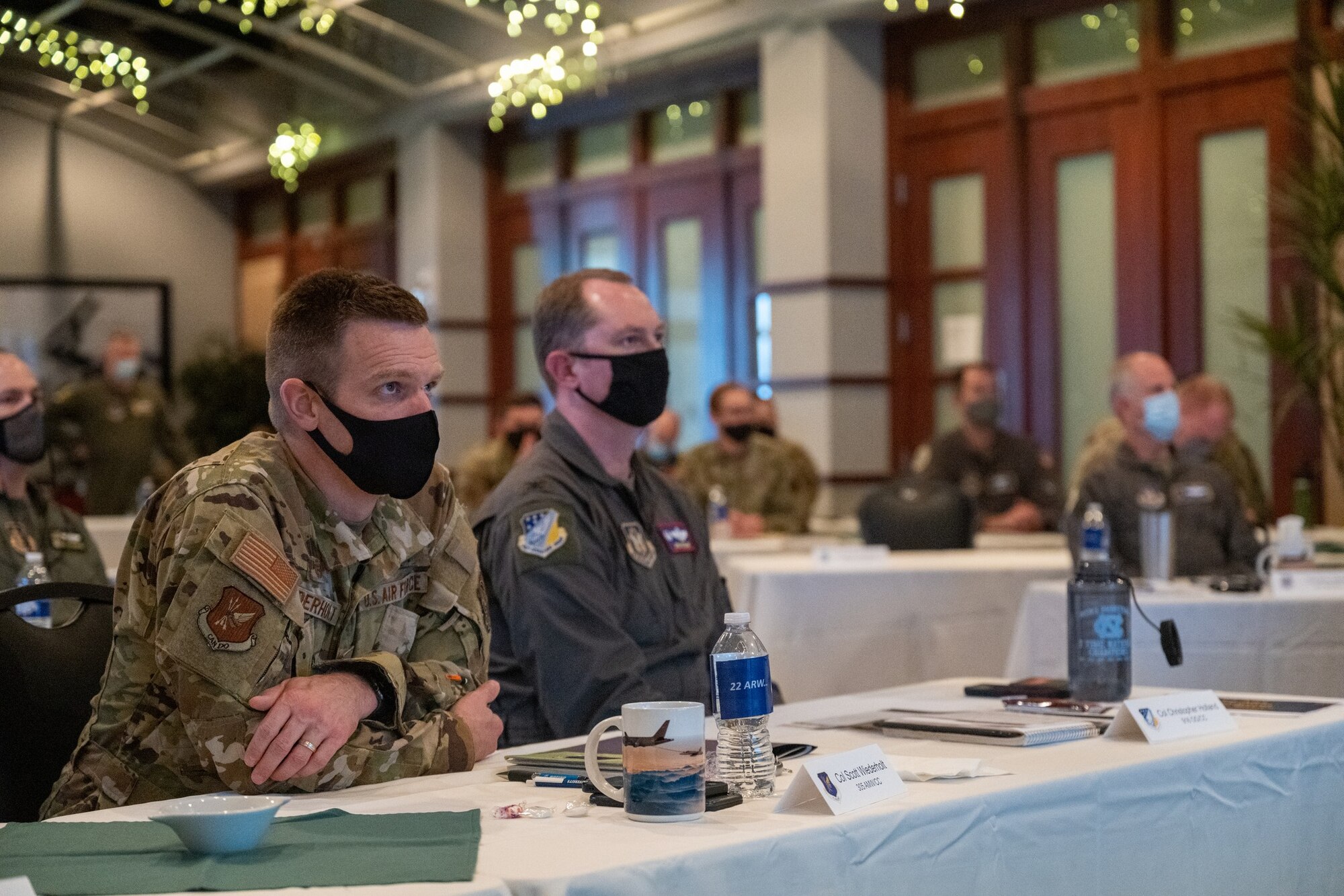 Col. Scott Wiederholt, 305th Air Mobility Wing commander, and Col. Christopher Holland, 916th Operations Group commander, attend a cyber security briefing as part of the first-ever KC-46 Weapons Systems Council Nov. 18, 2021, at McConnell Air Force Base, Kansas. The council was comprised of leaders and aircrews from AETC, ANG, AFRC, & AMC; aimed at synchronizing Total Force efforts. (U.S. Air Force photo by Staff Sgt. Nathan Eckert)