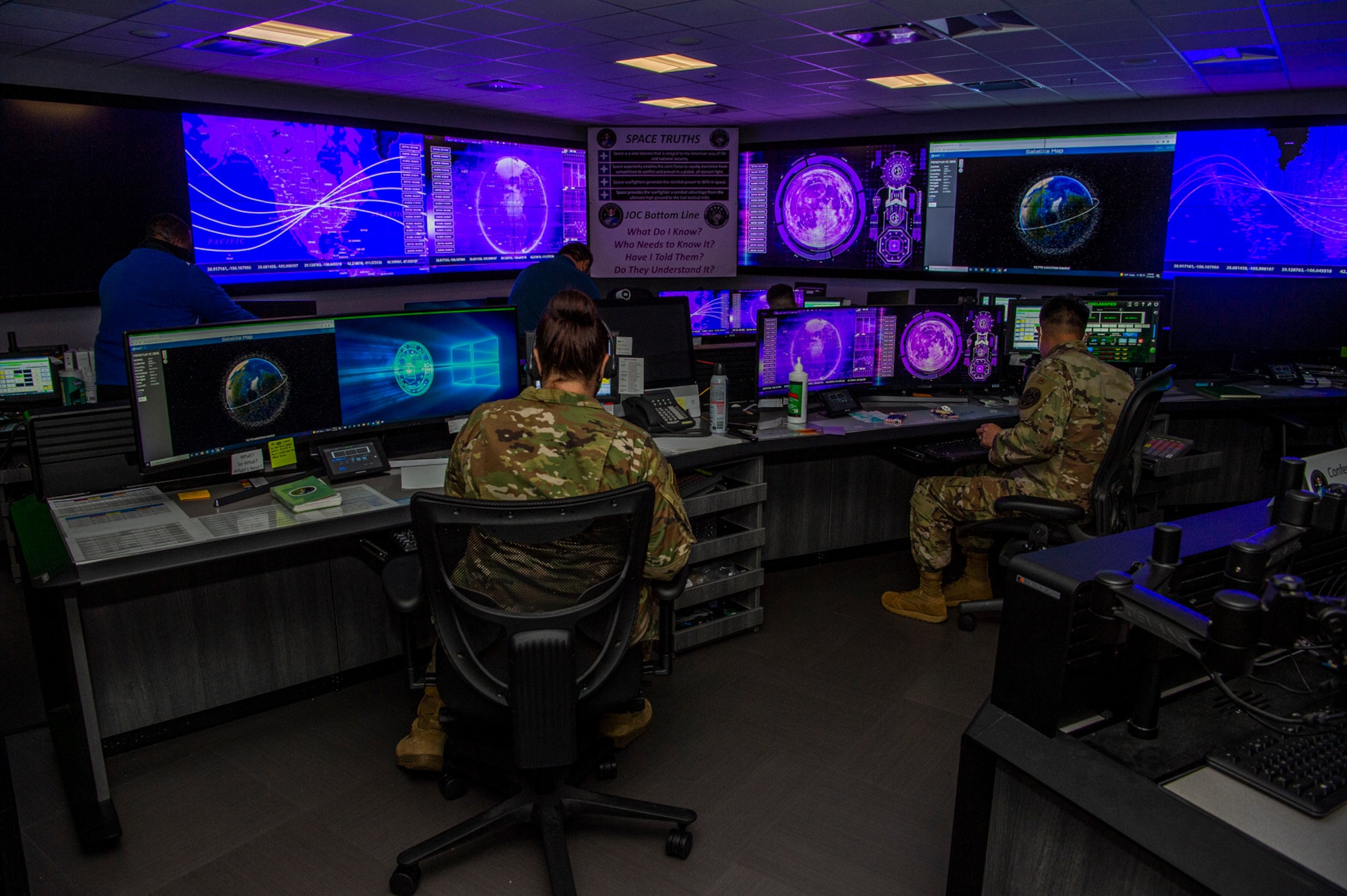 Military members conduct an exercise.