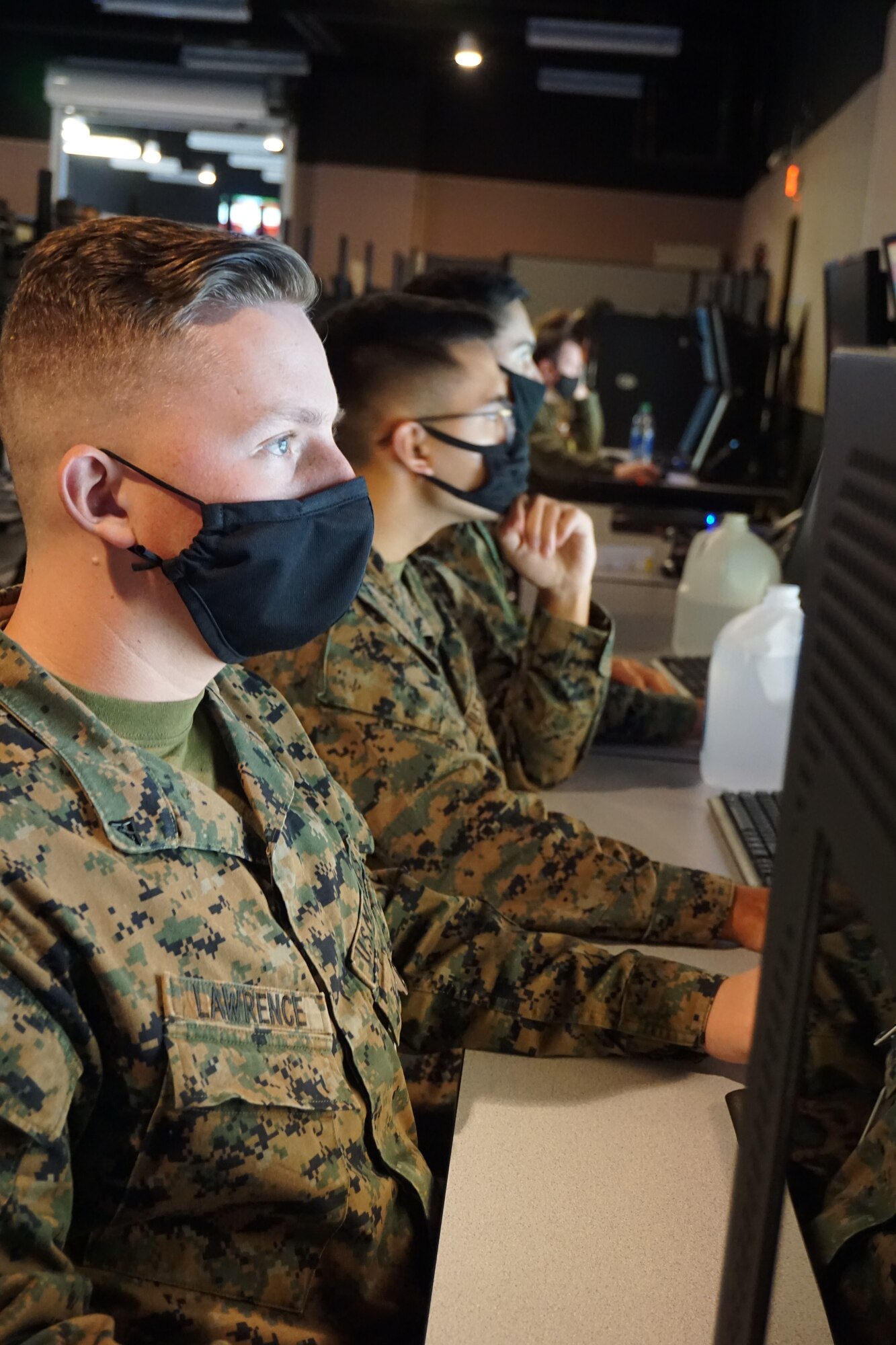 photo of U.S. Marines working on computers